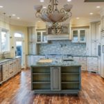large kitchen with custom cabinets and large island